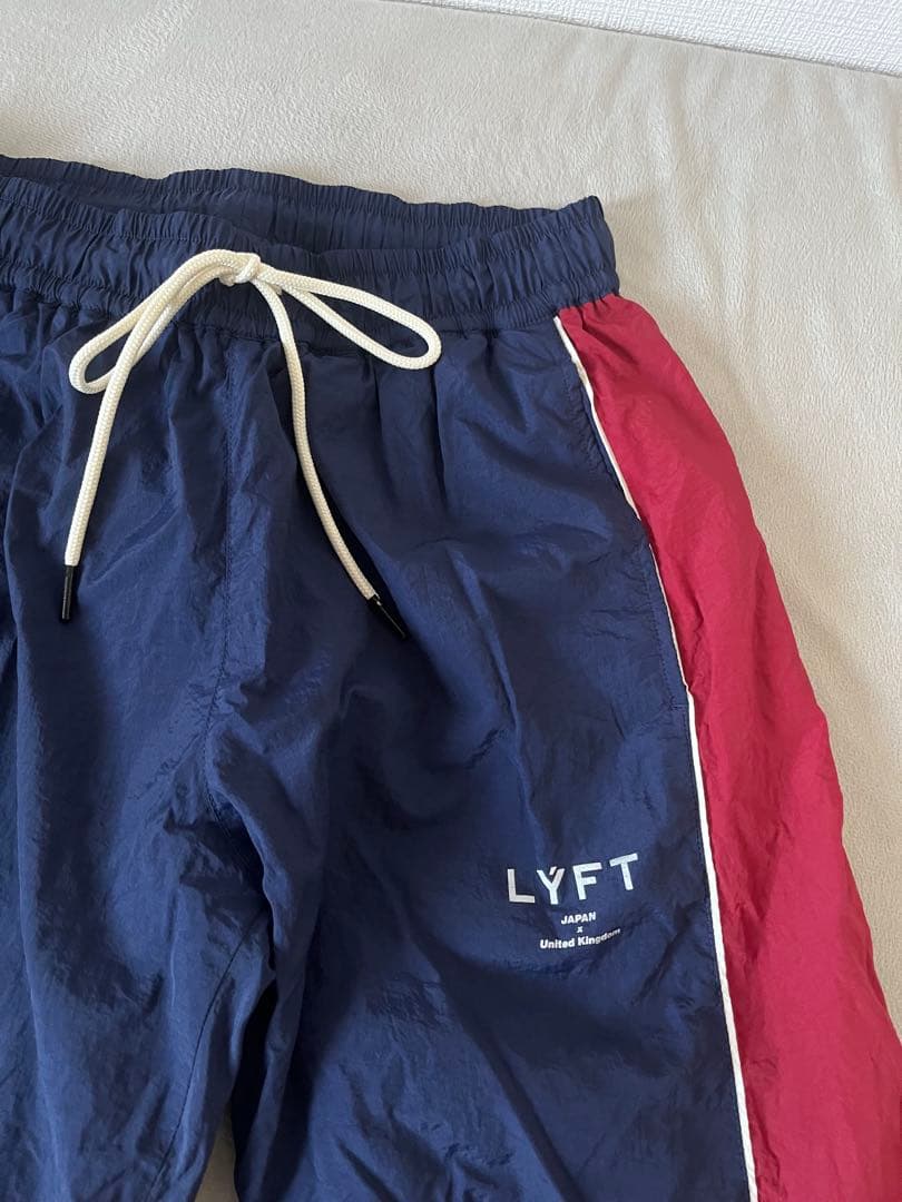LYFT サイドボタン ナイロン トラックパンツ ネイビー/ワインレッド M